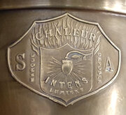 Chaleur Intens Lumiere S A lamp logo badge.jpg