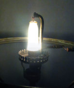 Unknown table lamp lit mantle.jpg